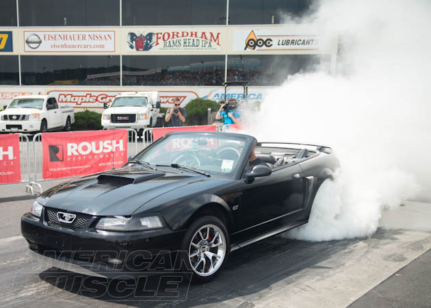 Black SN95 Mustang Doing a Burn Out