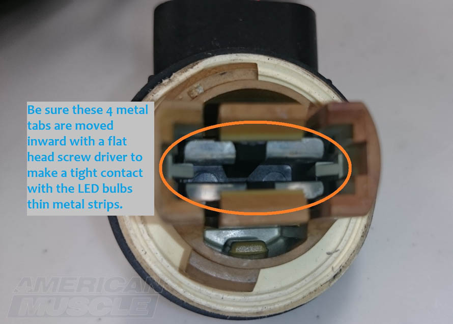 Bending the Metal Tabs Inward on the Bulb Sockets