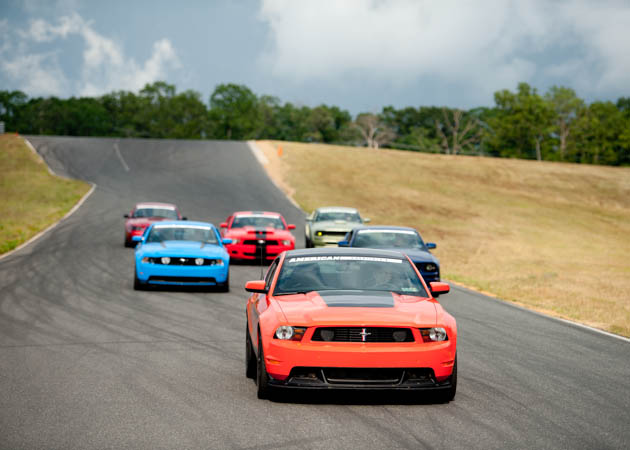 Many Generations of Mustangs at the Track