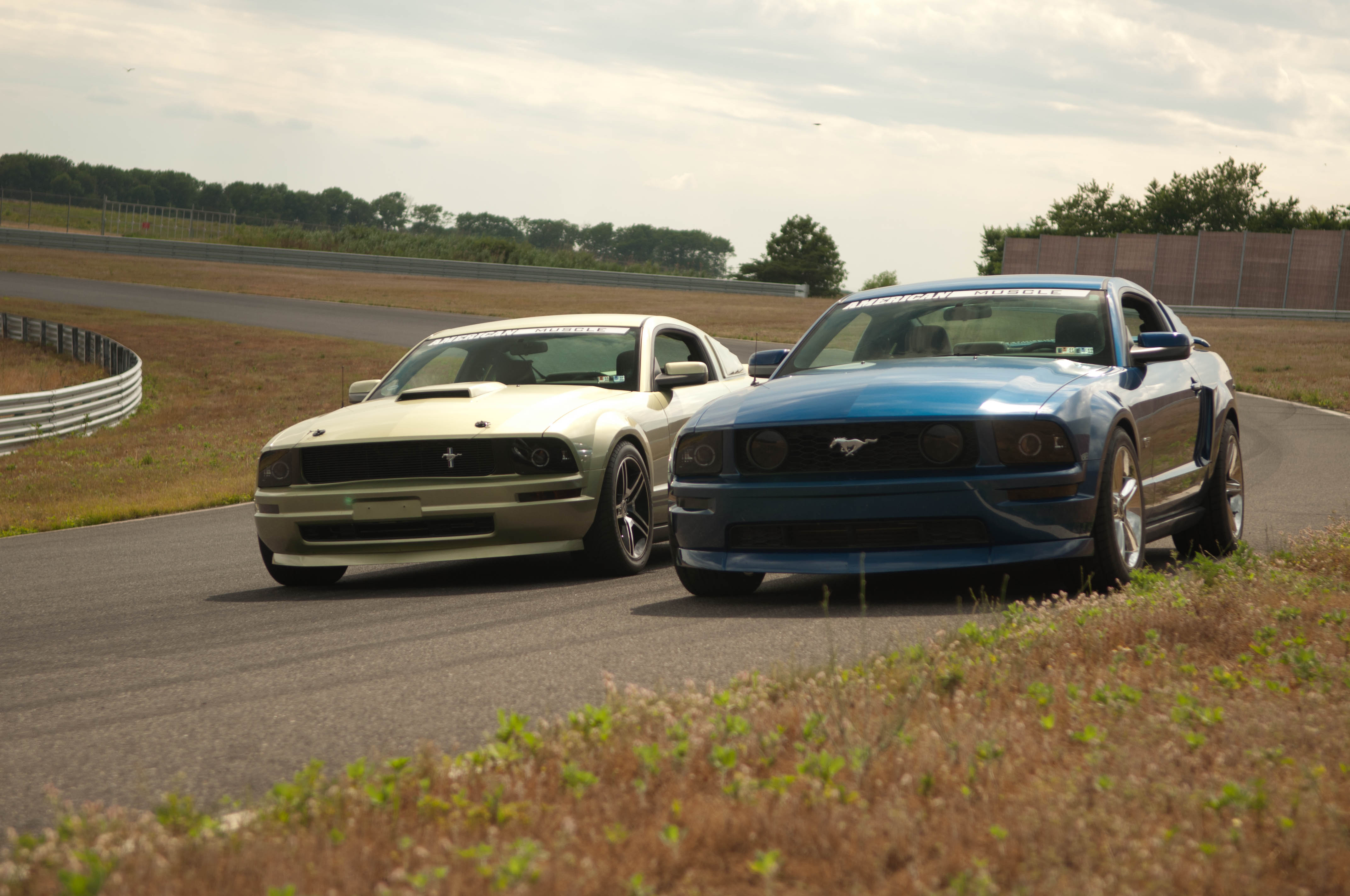 2005 and a 2009 Mustang at the Track